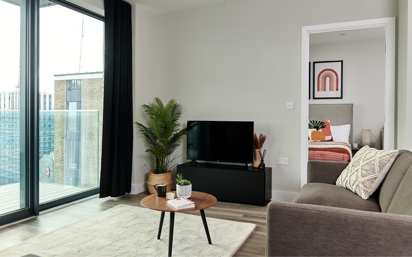 lounge, sofa, TV and views over Kew