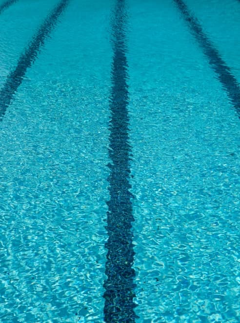 swimming pool, blue water, marked out lanes