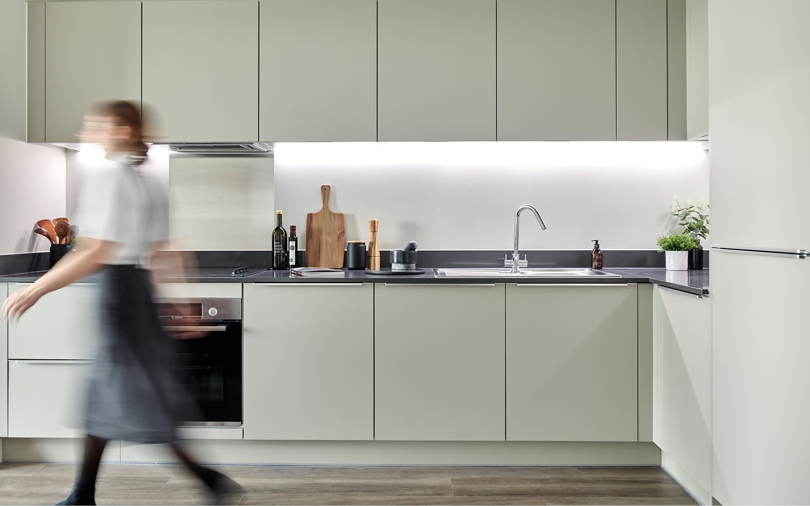 contemporary kitchen, person walking through