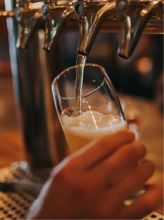 close up of a pint being poured