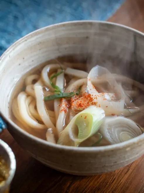 a steaming bowls of Japanese noodles