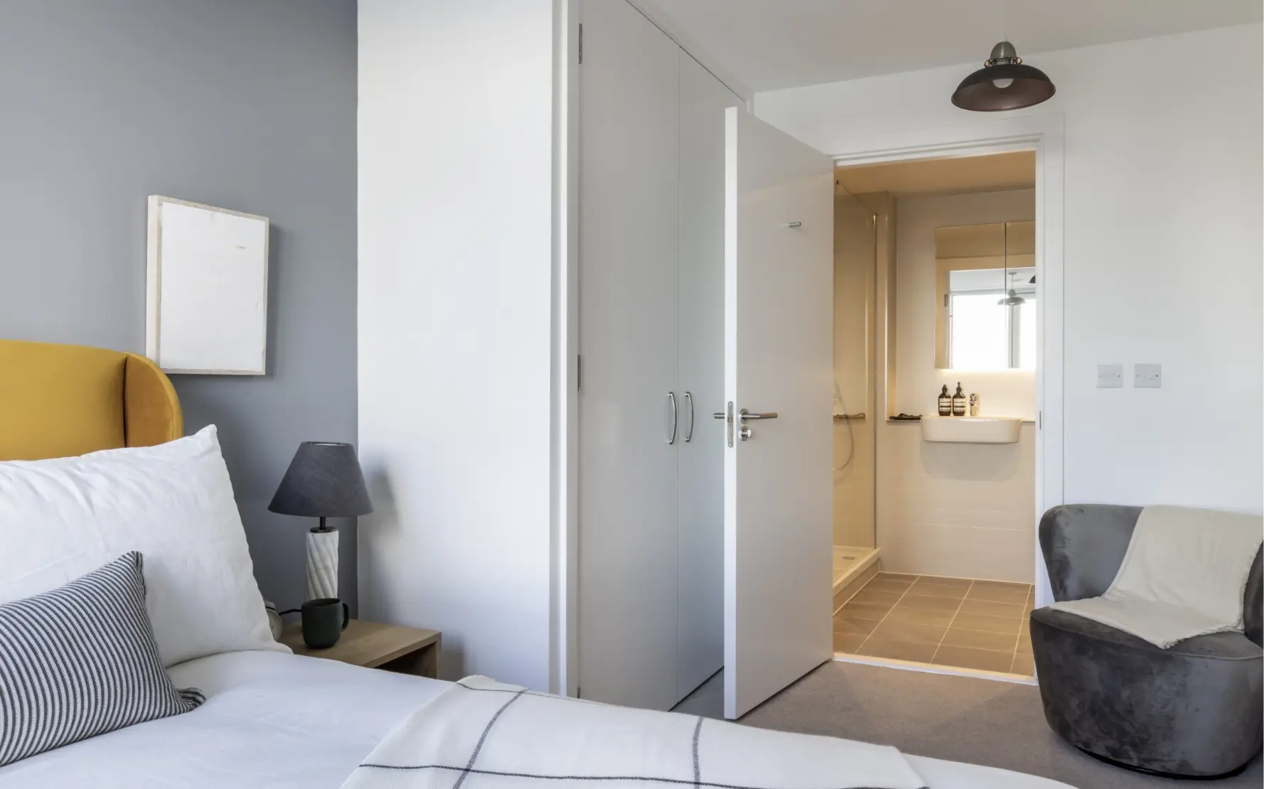 a double bed with fitted wardrobes