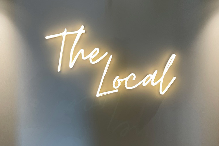 Neon sign saying the local
