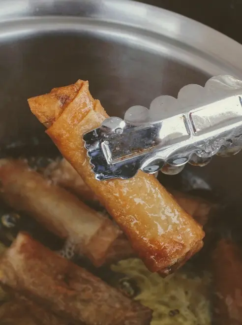 spring rolls being cooked