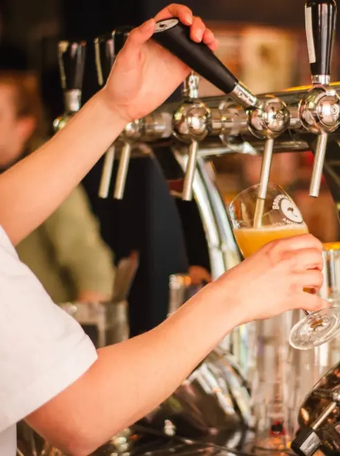 close up of a girl pulling a pint