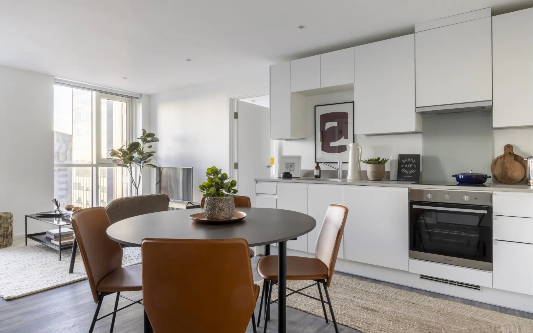 Stylish kitchen with small dining table and chairs